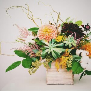 white and pink flowers on brown wooden box